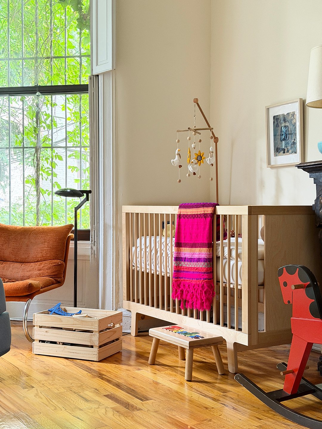 crib with pink blanket
