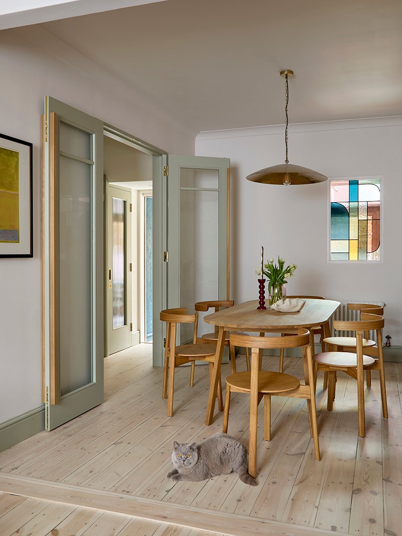 dining room with cat on floor
