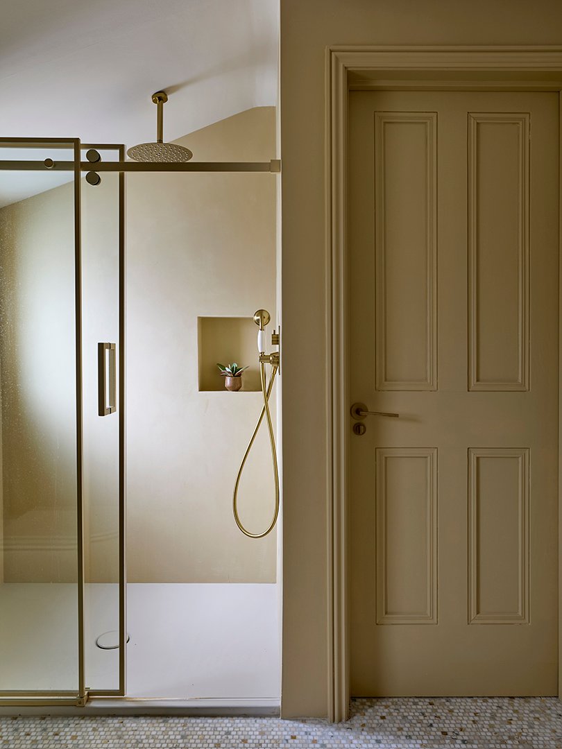 yellow bathroom with glass shower