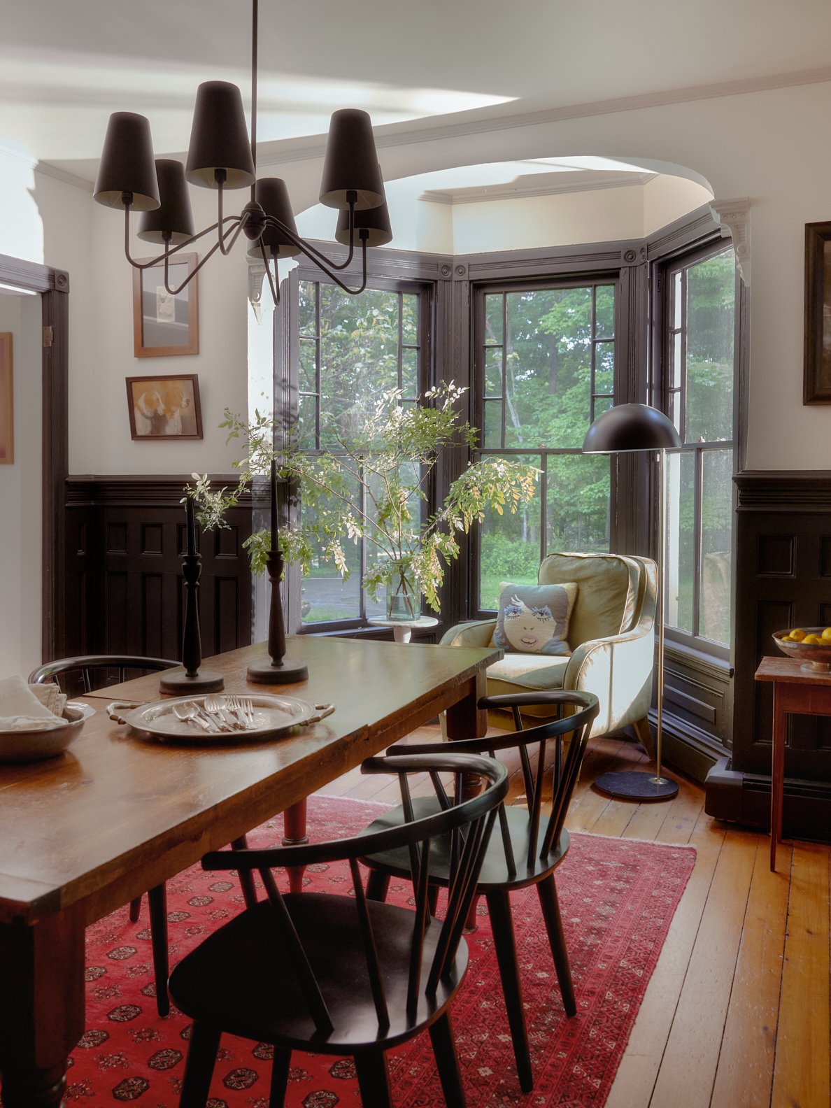 dining room with black accents and wood table