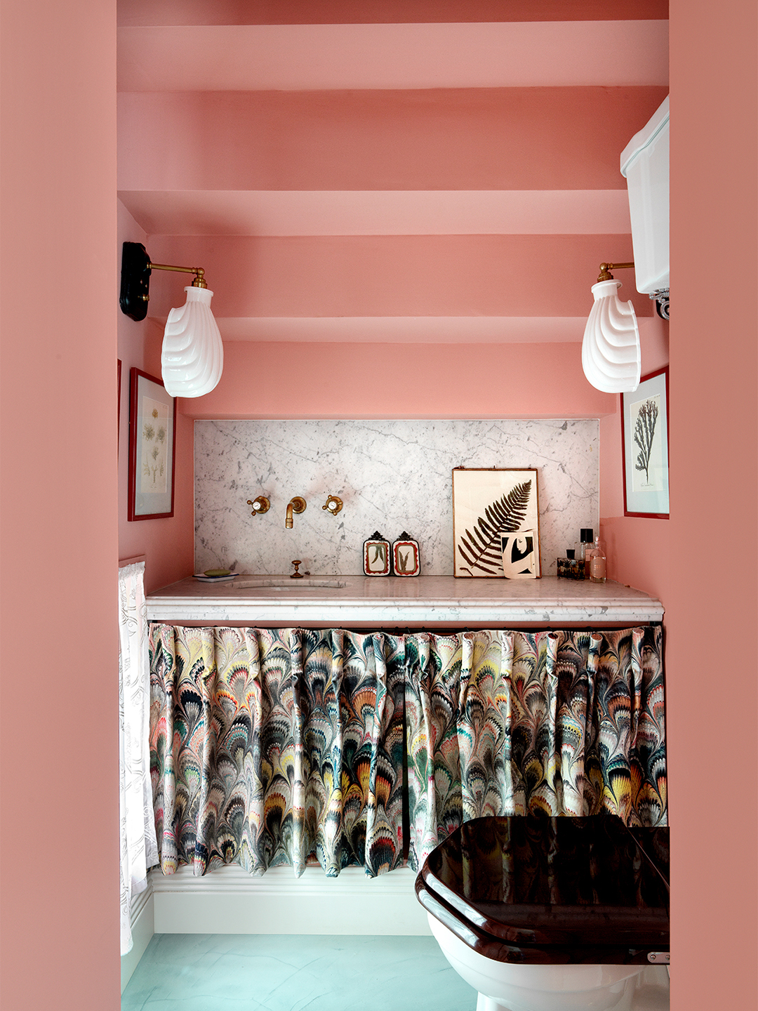 pink bathroom with ruffled skirt