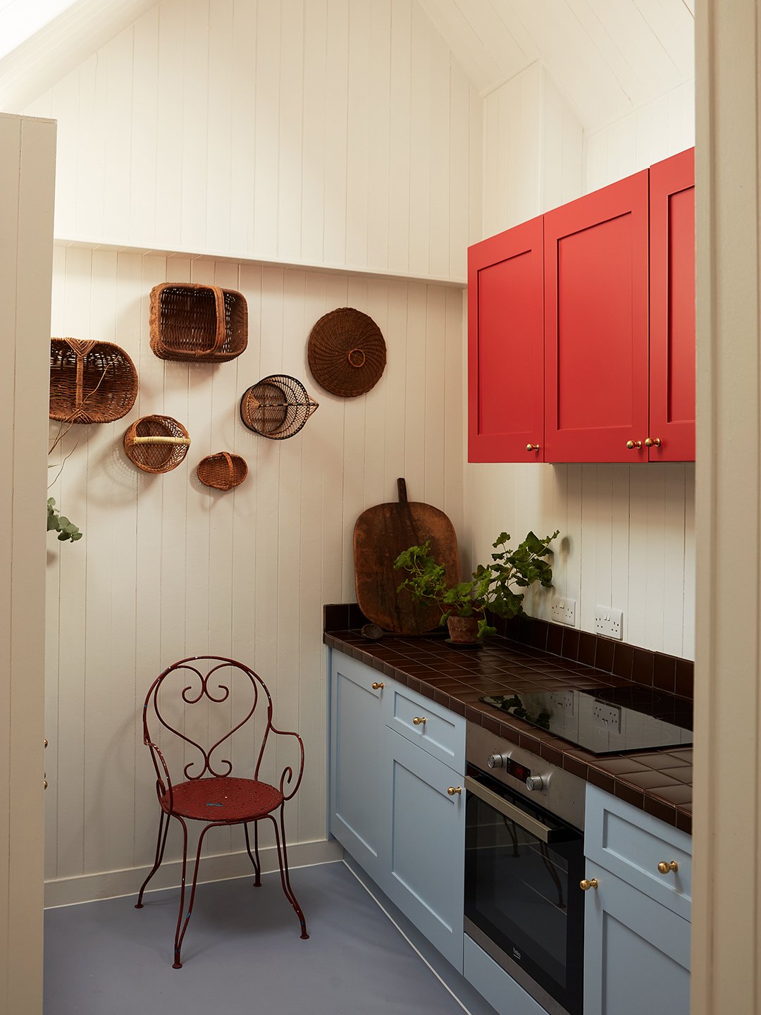 kitchen with blue and red cabinets
