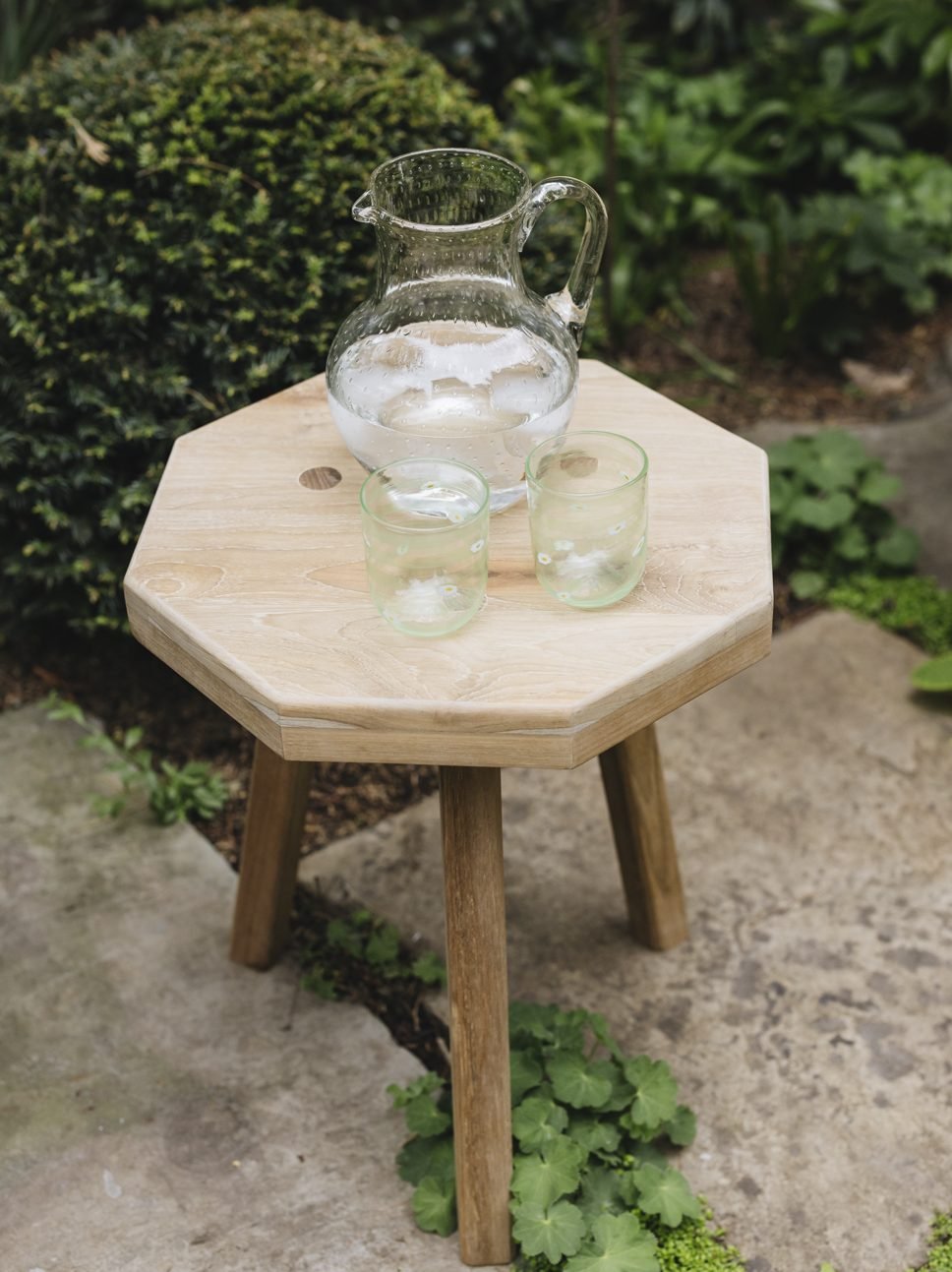 pitcher on wood stool
