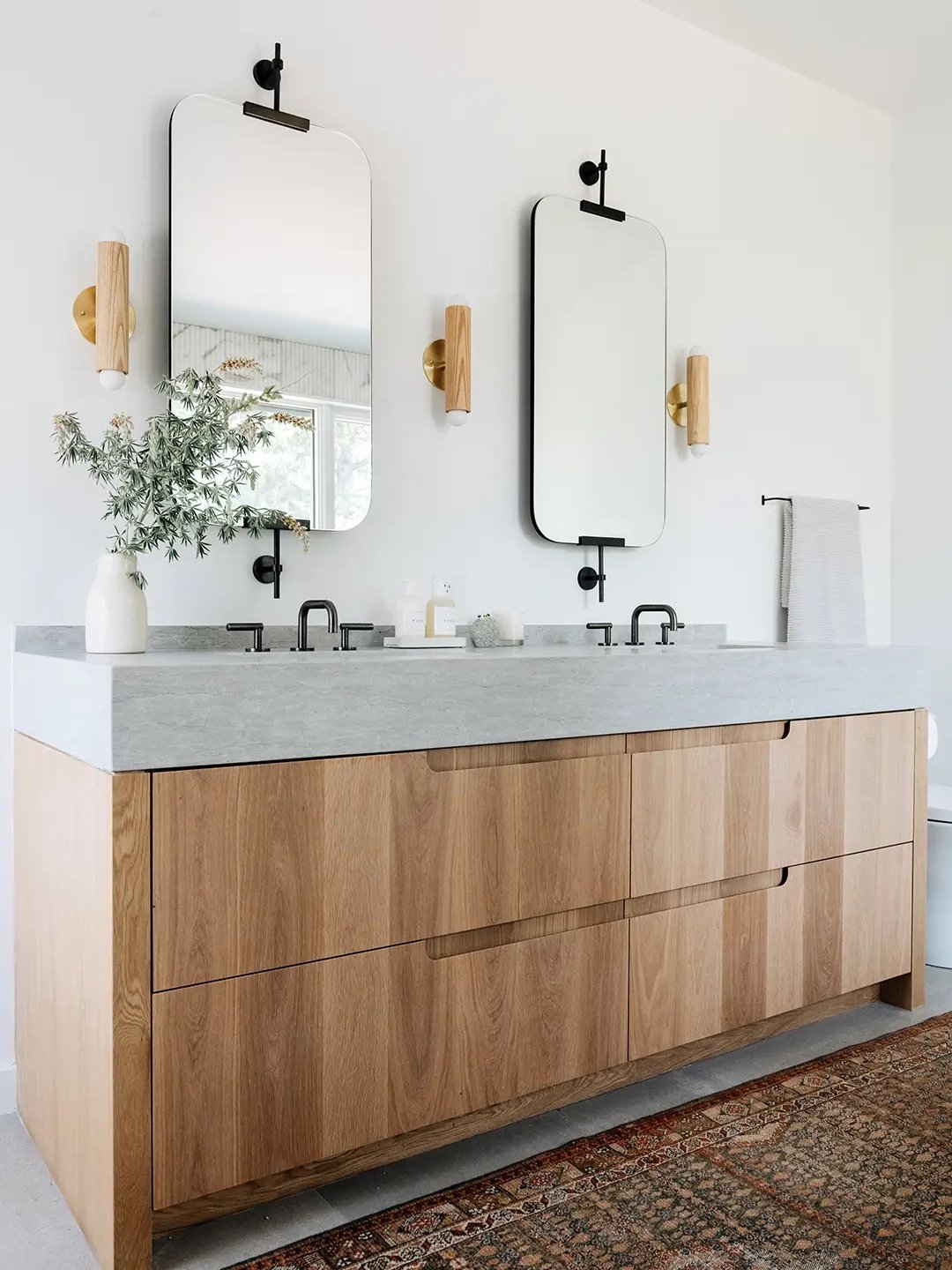 oak wood vanity with concrete counter